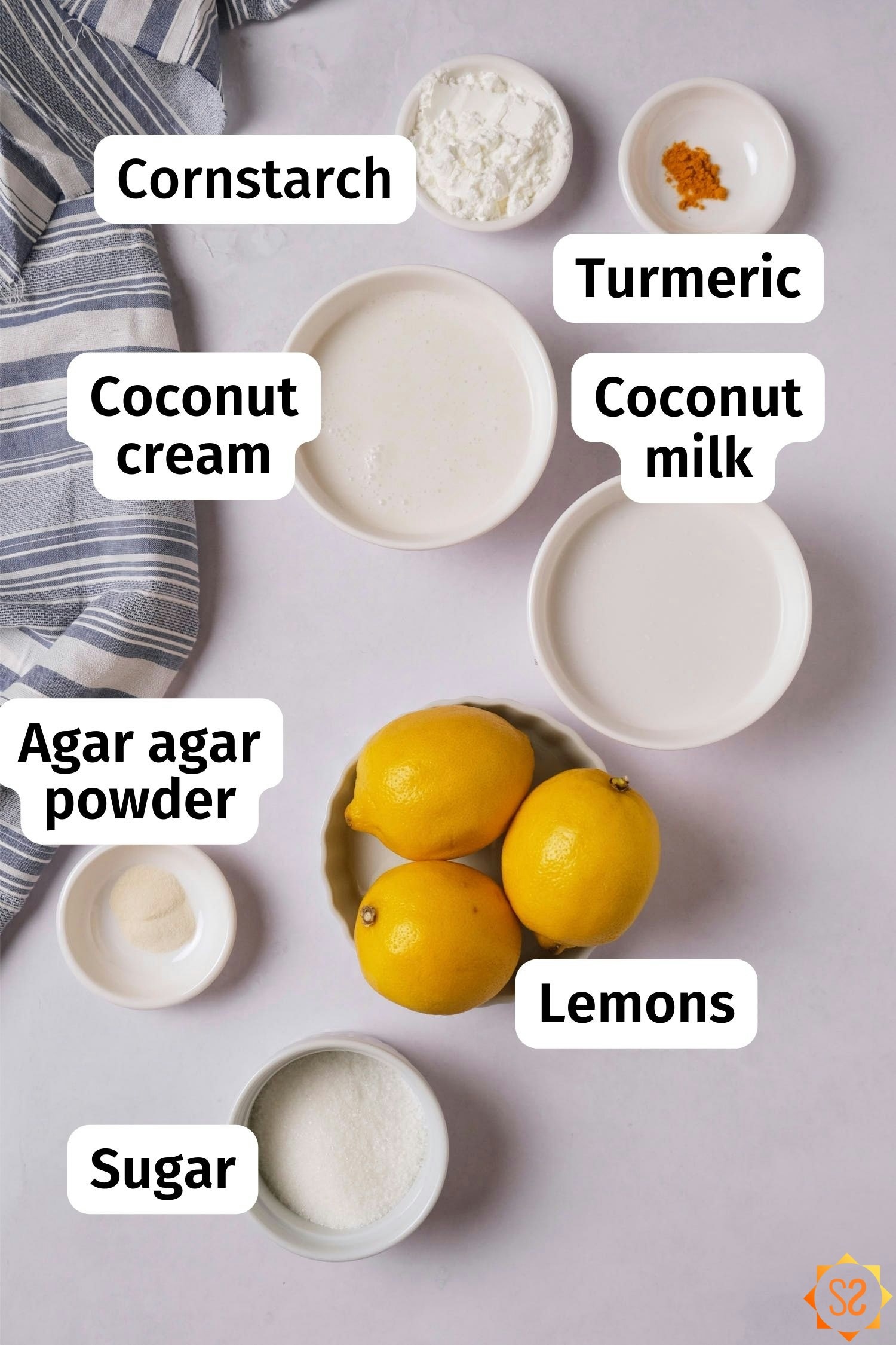 Ingredients for vegan lemon curd: coconut milk, coconut cream, cornstarch, turmeric, agar agar powder, lemons, sugar.