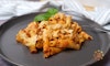 baked ziti on plate with basil