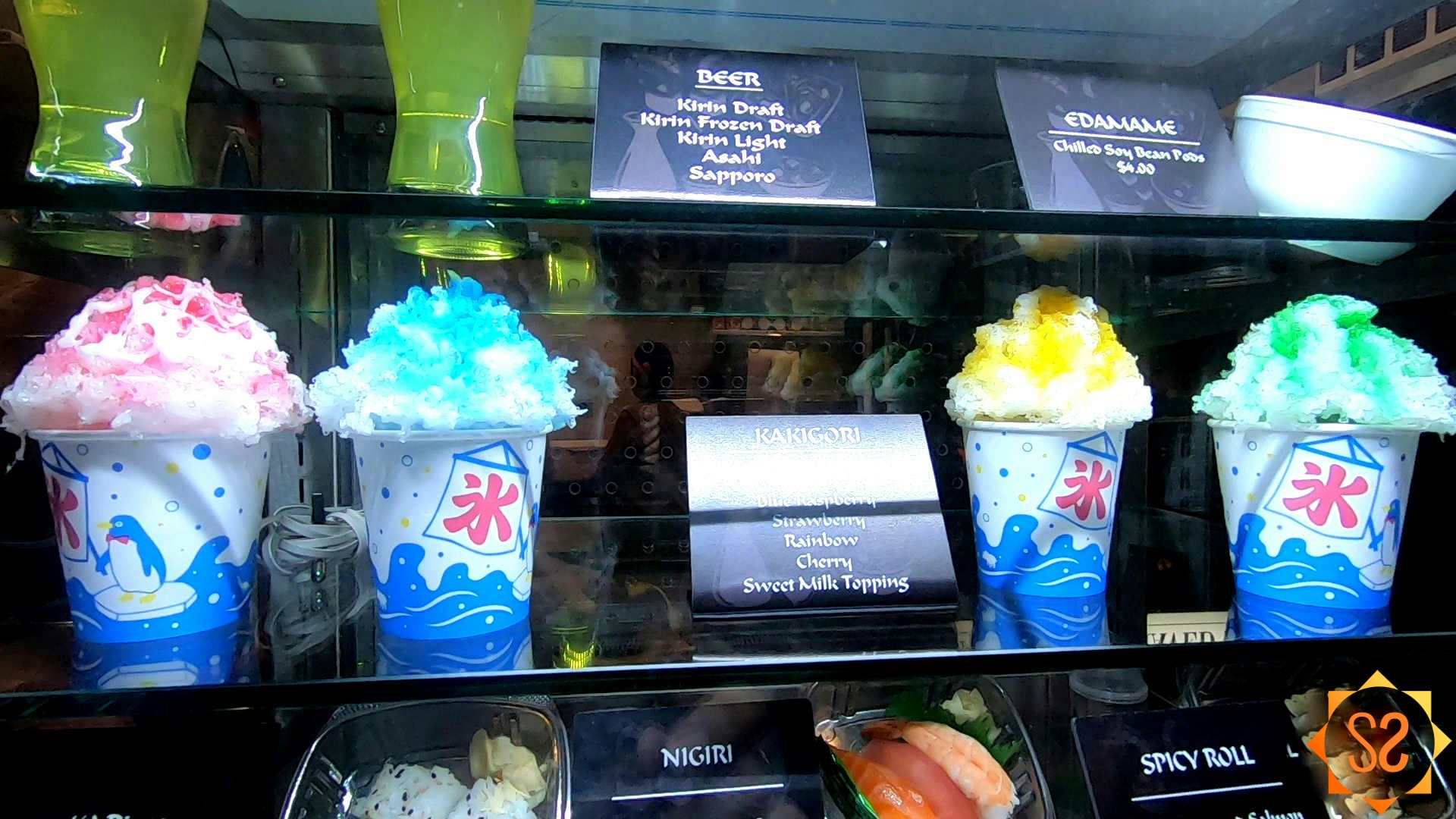 Four flavors of kakigori in a display case