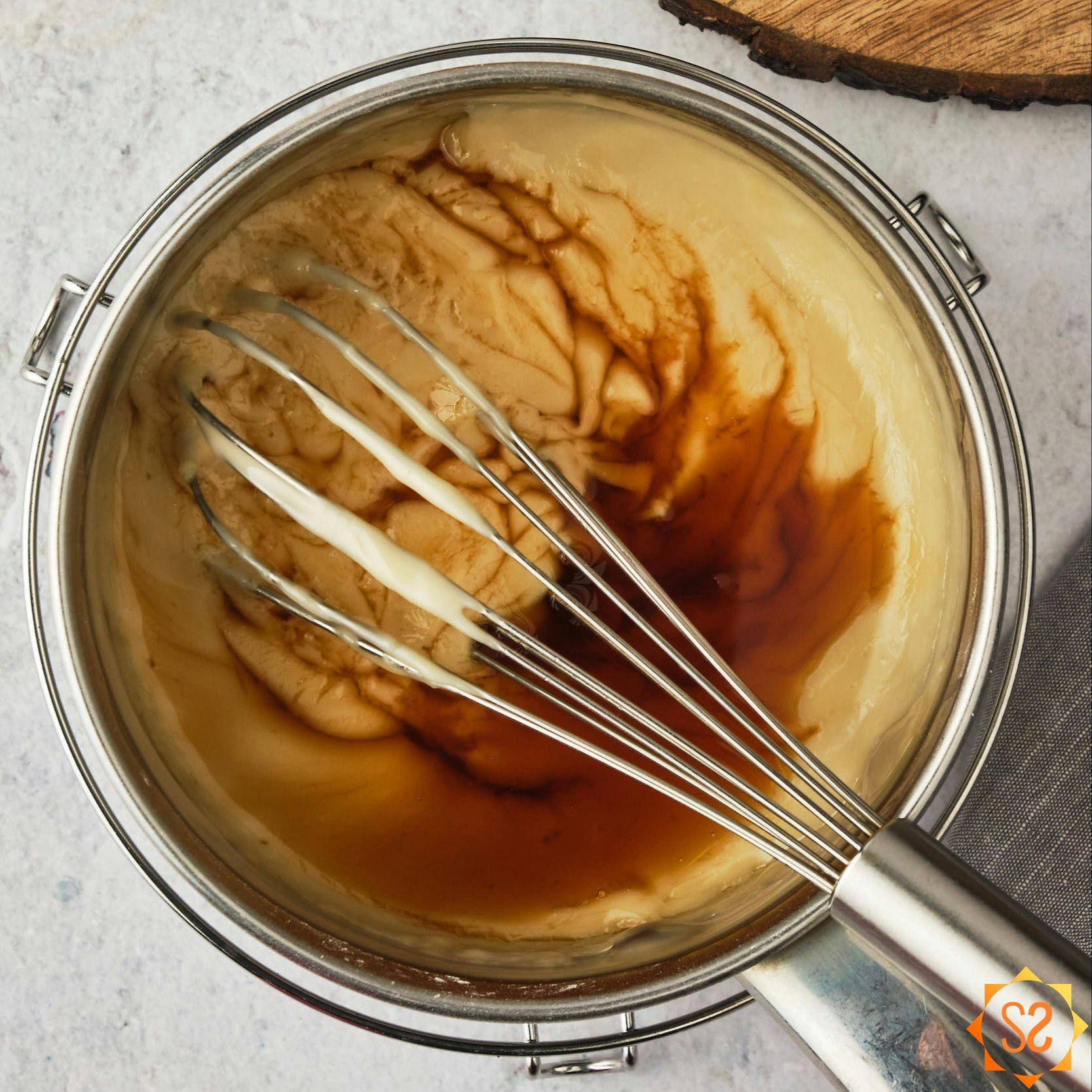Vegan pudding with vanilla being whisked in. 