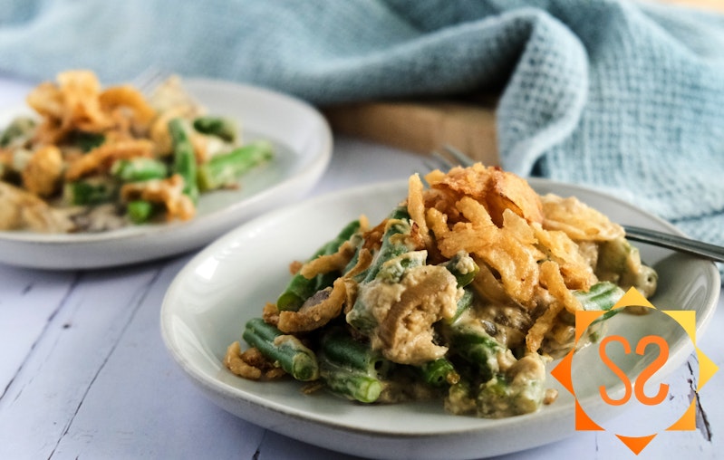 A close-up view of servings of green bean casserole on plates