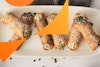 A wide view of vegan cannoli on a long platter.