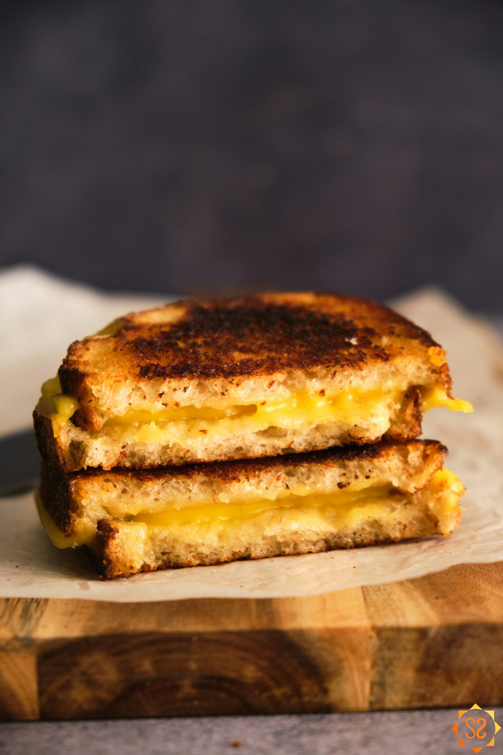 A side view of grilled cheese made with Chao creamy original, stacked