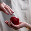 Woman handing a girl a poison apple