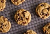 Ovenly's Secretly Vegan Salted Chocolate Chip Cookies cooling on a wire rack.