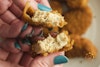 An Incogmeato Chik'n Nugget torn in half to show the texture of the vegan chicken inside.