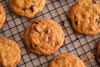 Simple Sweet Vegan Chocolate Chip Cookies cooling on a wire rack.