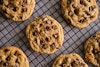 Baker By Nature's vegan chocolate chip cookies cooling on a wire rack.
