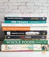 A stack of vegan cookbooks