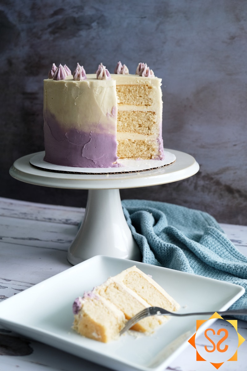 vegan vanilla cake with slice in foreground
