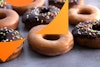 Side view of vegan glazed donuts and vegan chocolate frosted donuts