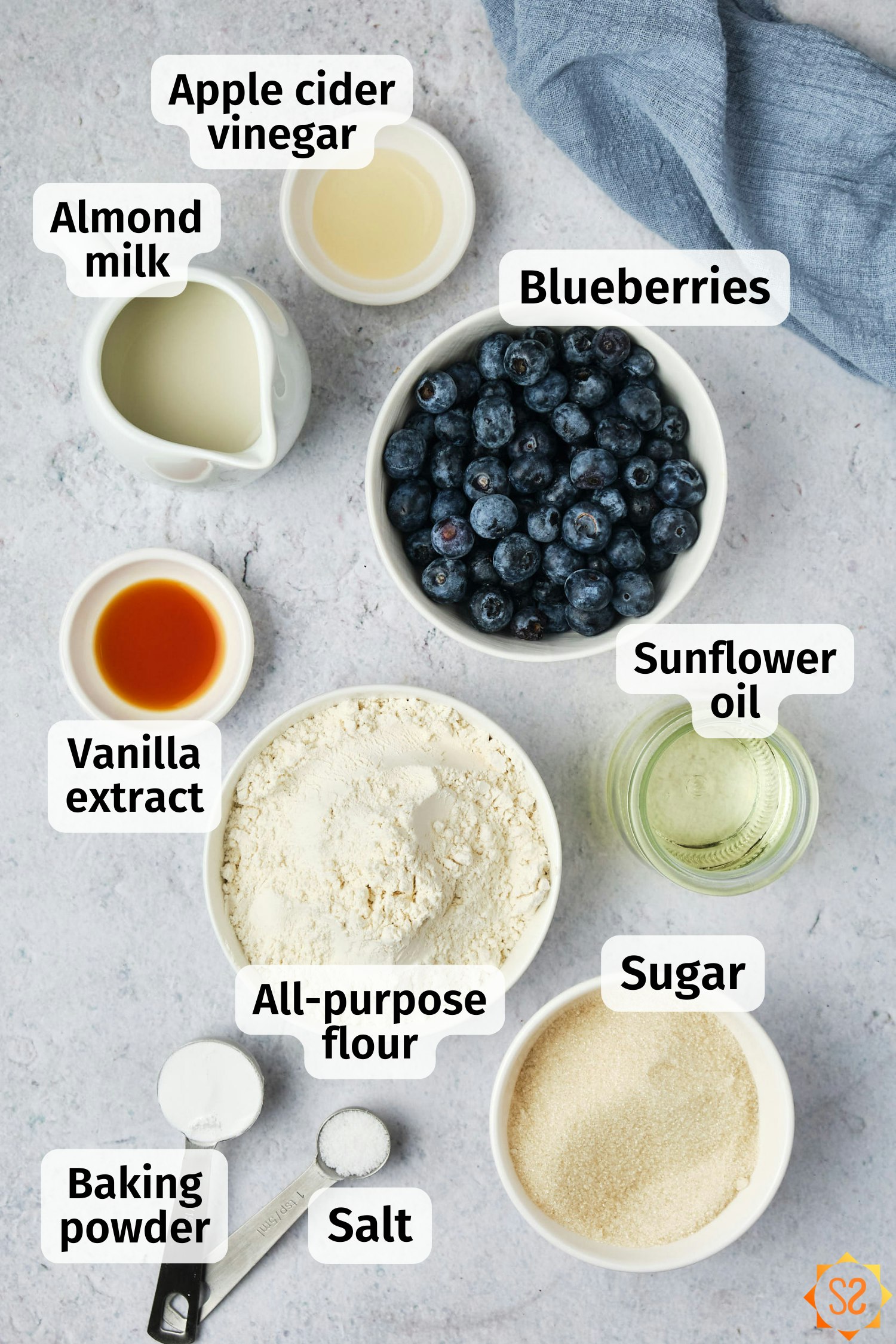 The ingredients for vegan blueberry muffins, labeled.