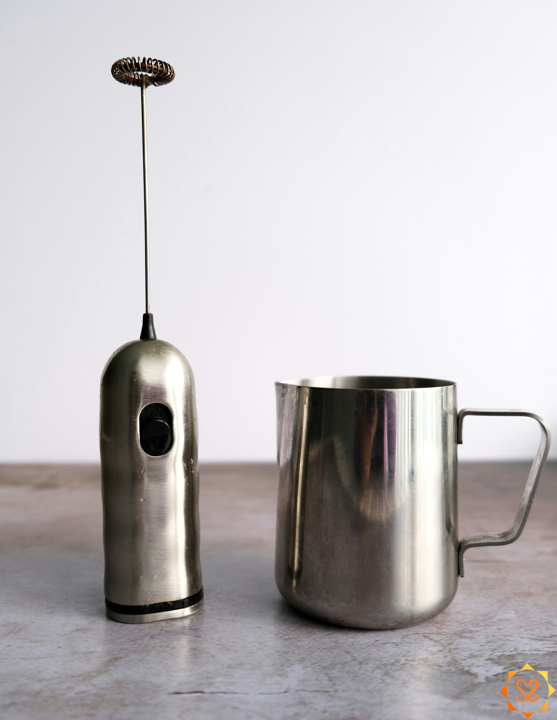 Milk frother and pitcher