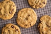 The New York Times's vegan chocolate chip cookies cooling on a wire rack.
