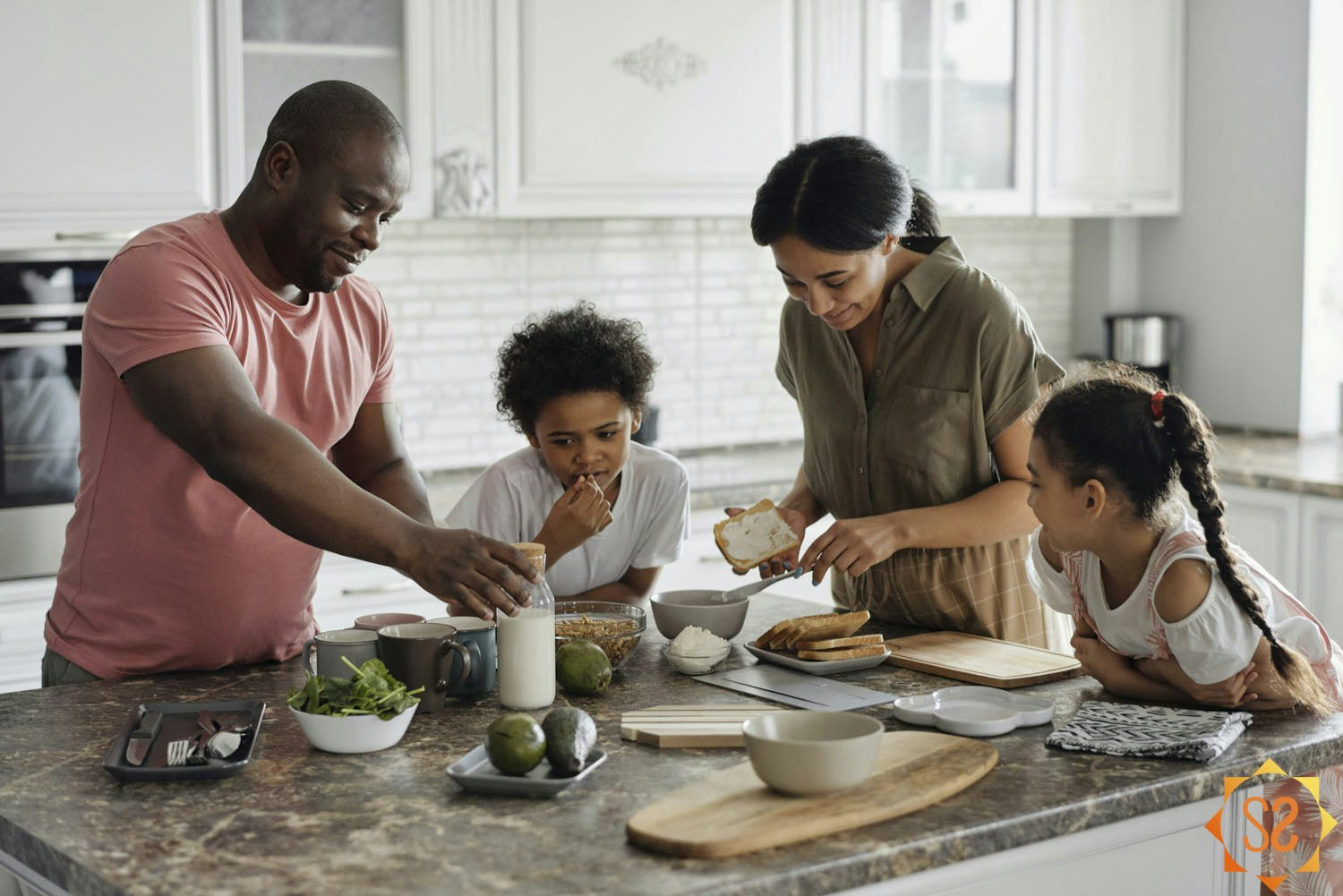 A family preparing a meal together in the kitchen.