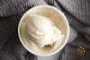 Wildgood vegan vanilla frozen dessert scooped inside its container.