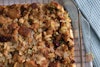 Vegan cranberry apple stuffing in a baking dish on a cooling rack